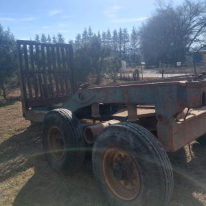 Walking beam timber tip trailer